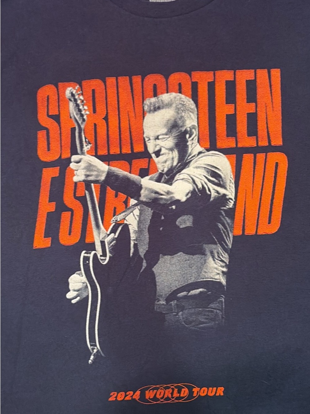 Black Graphic Tour Tee with Orange Lettering - 2024